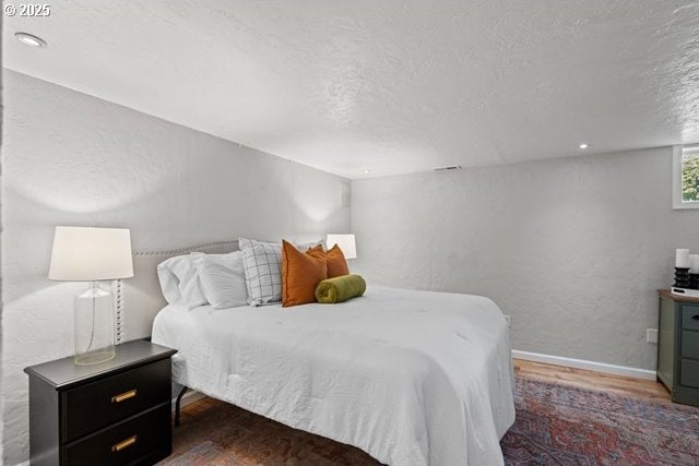 561 E Ridgeway Ave, Hermiston, OR 97838 - bedroom featuring wood finished floors and a textured ceiling