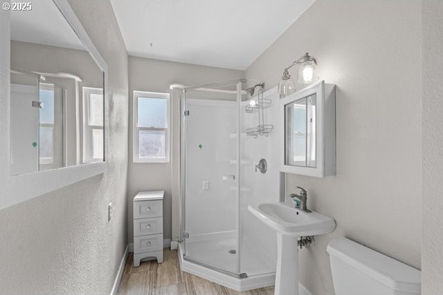 561 E Ridgeway Ave, Hermiston, OR 97838 - bathroom with a shower stall and wood finished floors