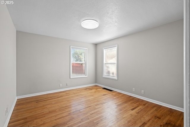 561 E Ridgeway Ave, Hermiston, OR 97838 - spare room with baseboards and light wood finished floors