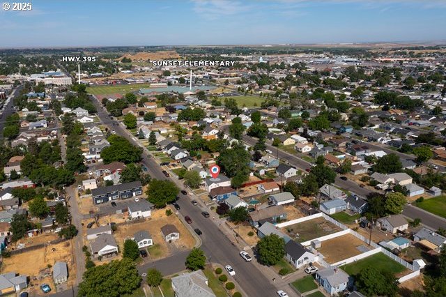 561 E Ridgeway Ave, Hermiston, OR 97838 - aerial overview of property's location with nearby suburban area