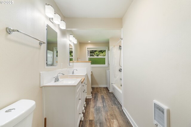 20220 E Peter Pl Unit 3, Sandy, OR 97055 - full bathroom featuring double vanity, wood finished floors, toilet, tub / shower combination, and baseboards
