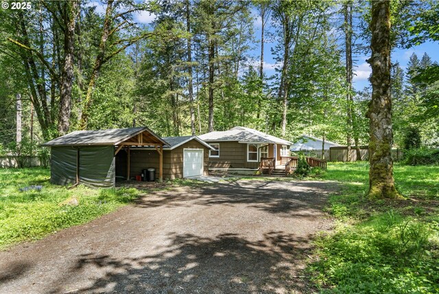 20220 E Peter Pl Unit 3, Sandy, OR 97055 - view of front of property featuring dirt driveway, an attached garage, and a wooden deck
