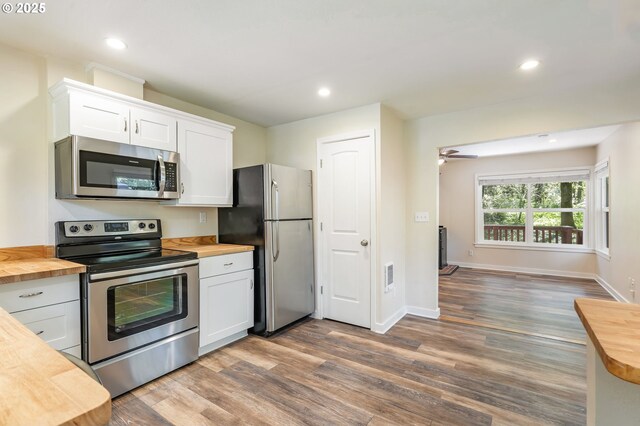 20220 E Peter Pl Unit 3, Sandy, OR 97055 - kitchen with stainless steel appliances, wood counters, white cabinetry, dark wood-type flooring, and recessed lighting