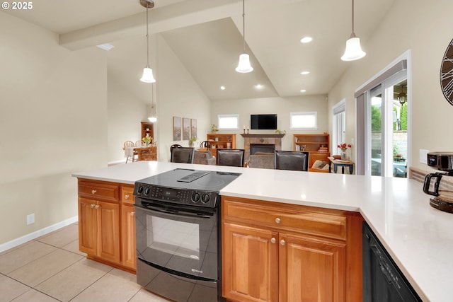 kitchen featuring black appliances, light countertops, light tile patterned floors, decorative light fixtures, and recessed lighting