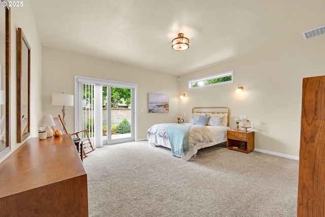 carpeted bedroom with access to outside, multiple windows, and baseboards