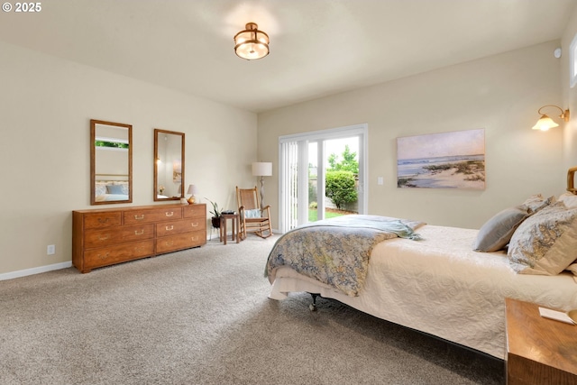 bedroom featuring access to exterior and carpet flooring