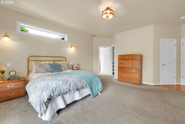 carpeted bedroom featuring baseboards