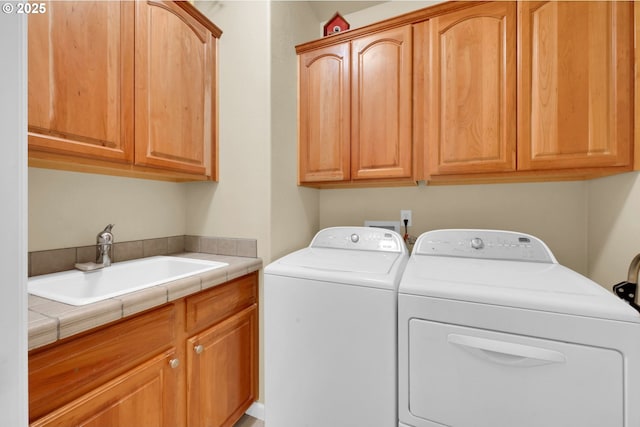 laundry area with cabinet space and washer and dryer