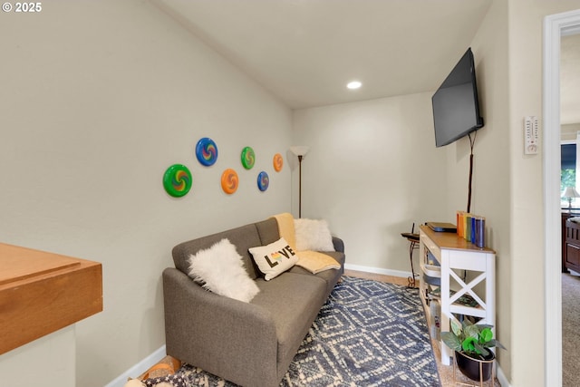 living area with recessed lighting, baseboards, and carpet floors