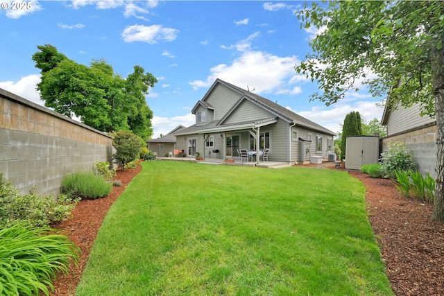 rear view of house with a patio area, a storage shed, and an outdoor structure