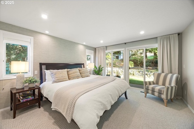 bedroom with baseboards, multiple windows, and recessed lighting