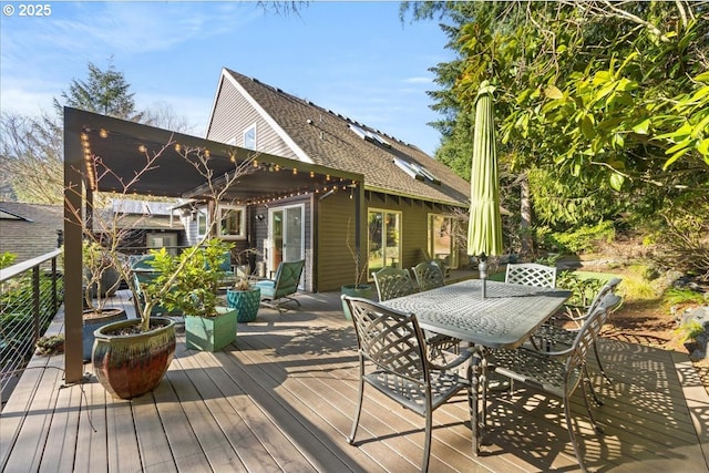 wooden terrace featuring outdoor dining space