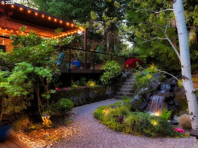 view of yard with stairway and a deck