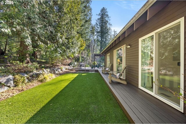 view of yard with a wooden deck