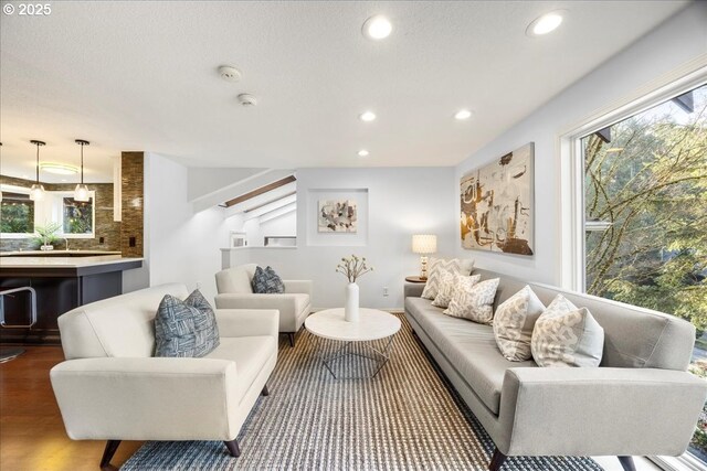 living area featuring recessed lighting and a wealth of natural light
