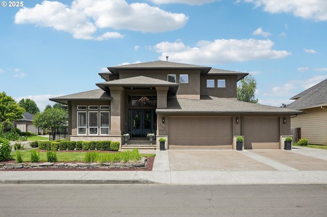 4706 NE 137th St, Vancouver, WA 98686 - prairie-style home with stucco siding, driveway, french doors, an attached garage, and roof with shingles