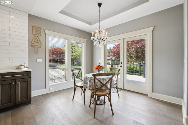 4706 NE 137th St, Vancouver, WA 98686 - dining area featuring light wood finished floors, a chandelier, and a raised ceiling