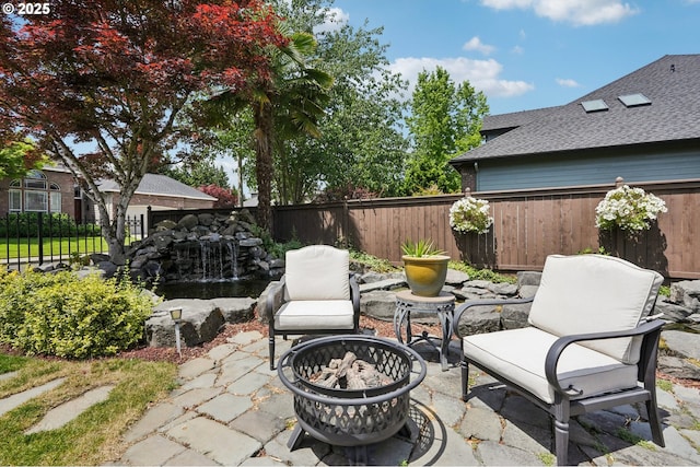 4706 NE 137th St, Vancouver, WA 98686 - view of patio with an outdoor fire pit and a small pond