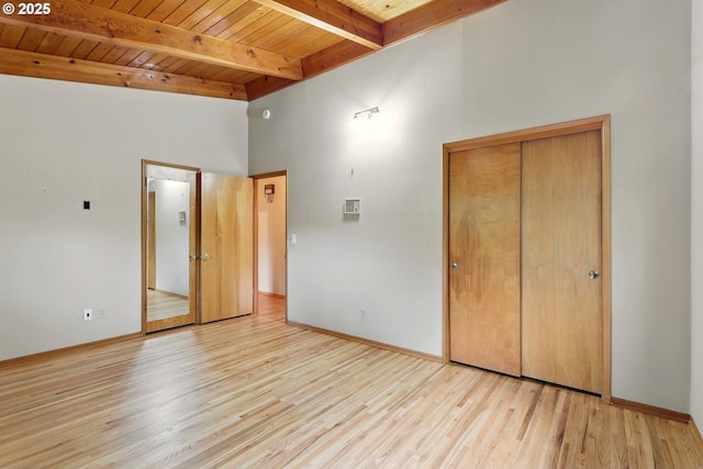 845 NW Day Dr, Gresham, OR 97030 - unfurnished bedroom featuring wood ceiling with exposed beams, wood finished floors, high vaulted ceiling, baseboards, and a closet
