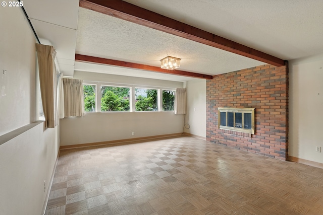 845 NW Day Dr, Gresham, OR 97030 - unfurnished living room featuring baseboards, a textured ceiling, beam ceiling, and a brick fireplace