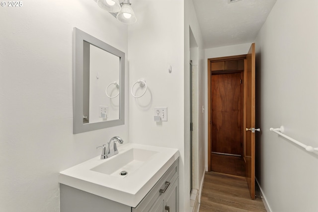845 NW Day Dr, Gresham, OR 97030 - bathroom featuring vanity and wood finished floors