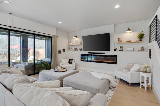 living room with light hardwood / wood-style floors