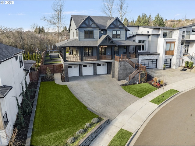 view of front of property with a front yard and a garage