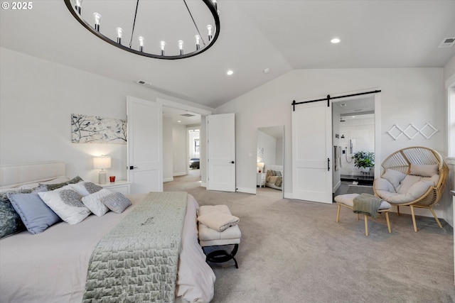 carpeted bedroom featuring a barn door and lofted ceiling