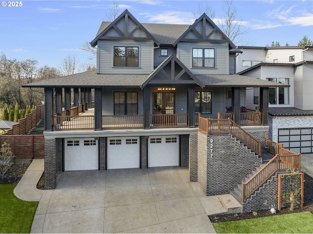 view of front of house featuring a garage and a porch