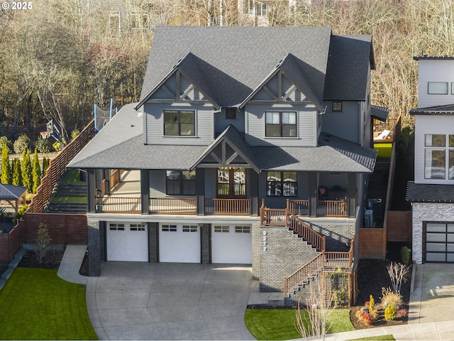 view of front of house with a porch and a garage