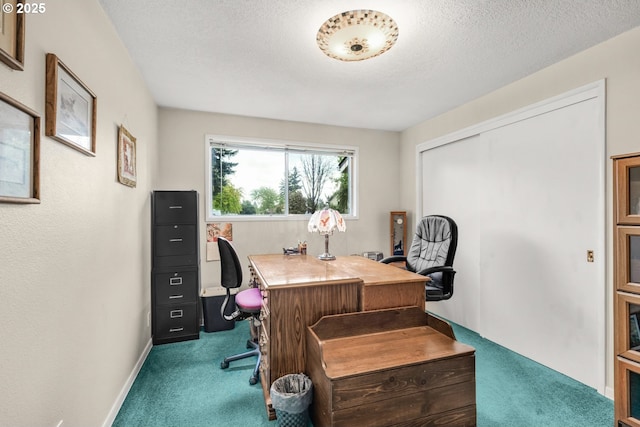office featuring carpet, a textured ceiling, and baseboards