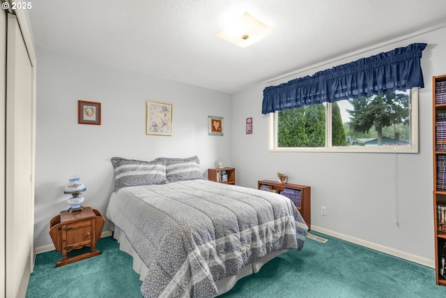 bedroom with carpet and baseboards