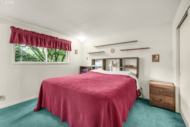 bedroom with carpet flooring and baseboards