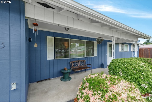 view of exterior entry with covered porch