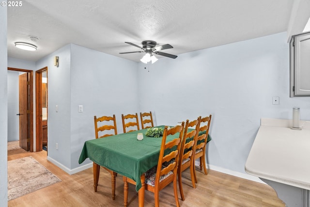 650 Harlow Rd Unit 233, Springfield, OR 97477 - dining area featuring baseboards, ceiling fan, a textured ceiling, and light wood-style flooring