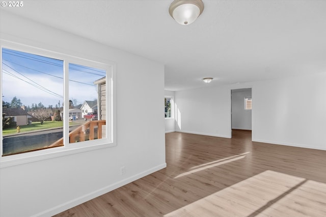 spare room featuring wood-type flooring