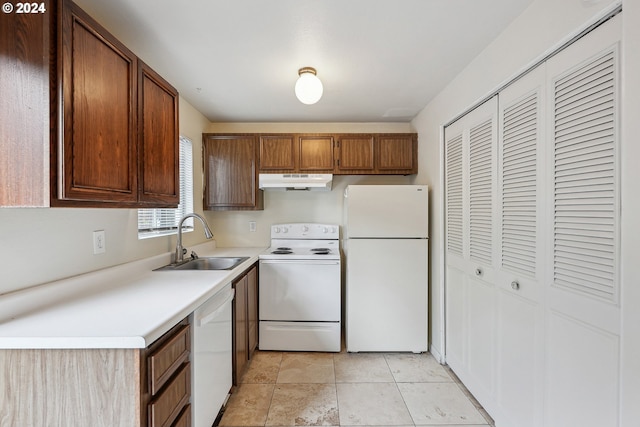 3103/3109 SE 6th Ave, Portland, OR 97202 - kitchen with under cabinet range hood, a sink, white appliances, light countertops, and light tile patterned floors