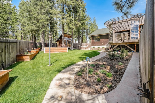 11 Deer Ridge Rd, Goldendale, WA 98620 - view of yard with a deck, a vegetable garden, a fenced backyard, and a pergola