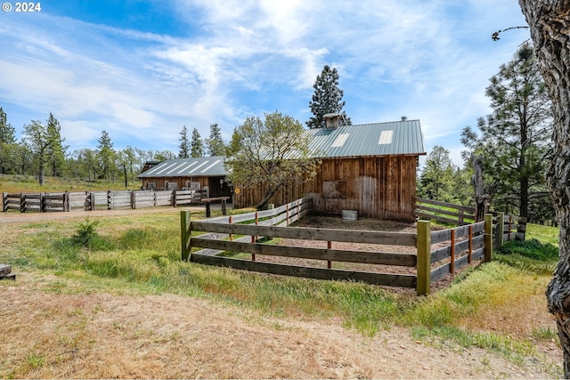 11 Deer Ridge Rd, Goldendale, WA 98620 - deck featuring an outdoor structure, a rural view, and an exterior structure