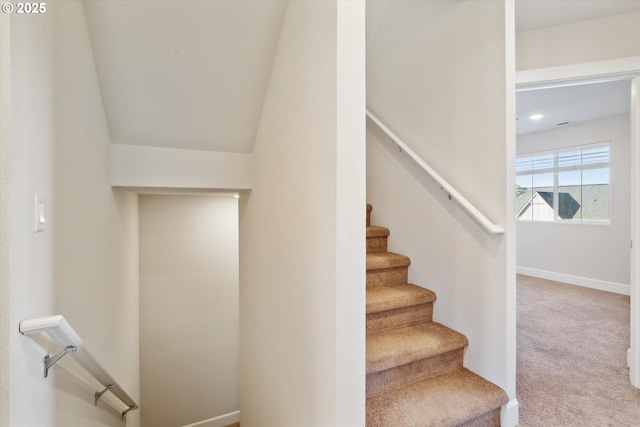 staircase with carpet and baseboards