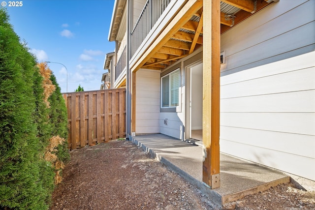 view of property exterior featuring fence