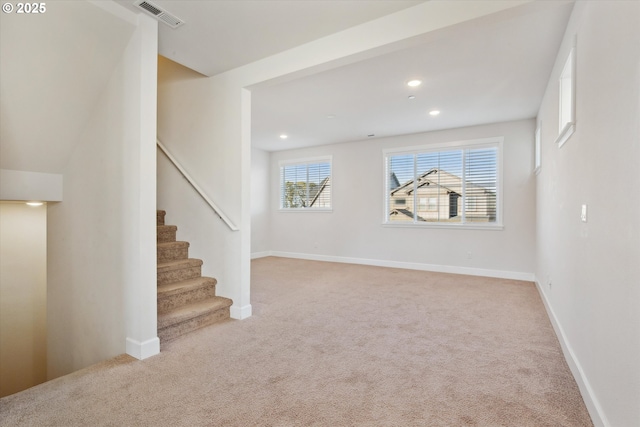interior space with stairway, baseboards, visible vents, carpet floors, and recessed lighting