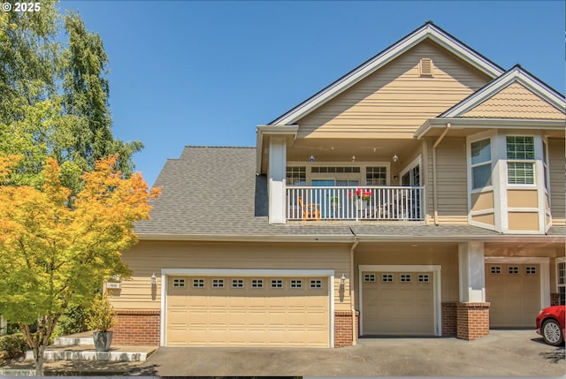 4630 Summerlinn Way W, Linn, OR 97068 - view of front of property with a balcony, brick siding, a garage, driveway, and a shingled roof