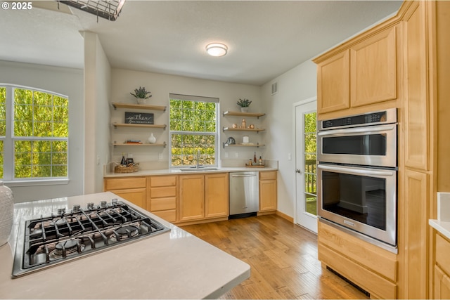 4630 Summerlinn Way W, Linn, OR 97068 - kitchen featuring stainless steel appliances, open shelves, light brown cabinetry, and light countertops