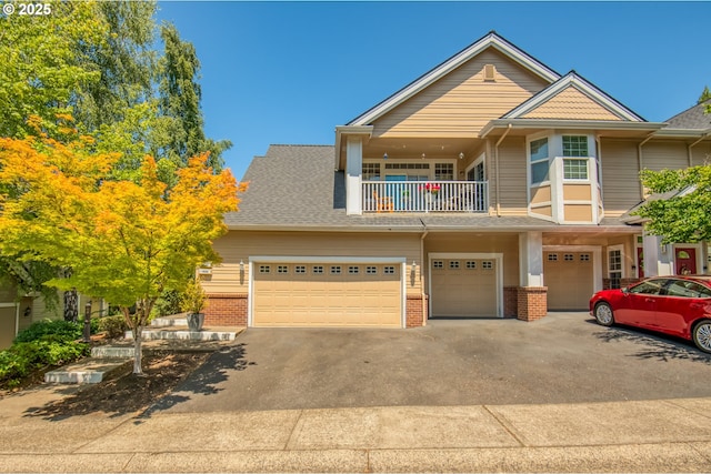 4630 Summerlinn Way W, Linn, OR 97068 - view of front of home with a balcony, brick siding, asphalt driveway, a garage, and roof with shingles
