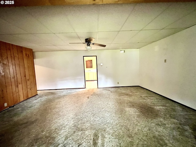 524 Buckhorn Rd, Roseburg, OR 97470 - empty room featuring wooden walls, ceiling fan, and a drop ceiling