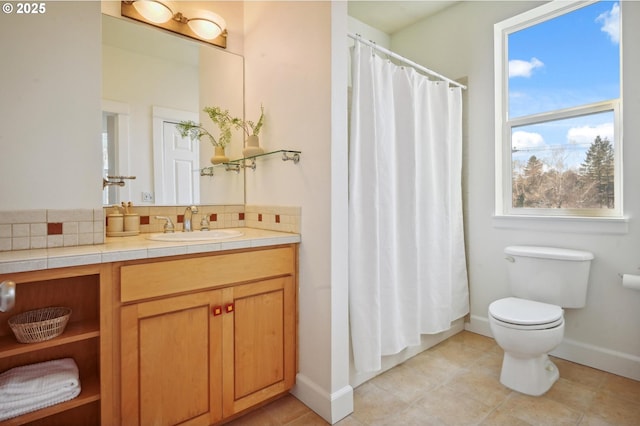 bathroom with toilet, vanity, decorative backsplash, and a shower with curtain