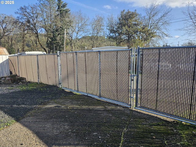 view of gate with fence