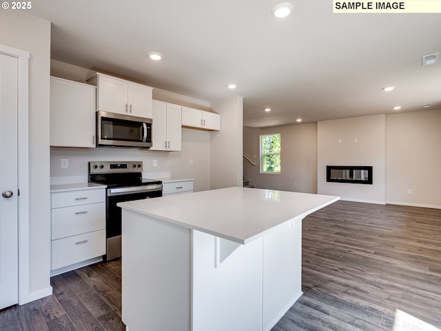 laundry area with washer hookup, hookup for an electric dryer, laundry area, light wood-style floors, and gas dryer hookup
