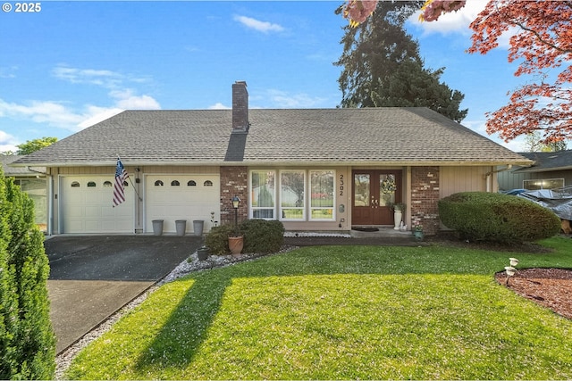 single story home featuring french doors, a front lawn, driveway, brick siding, and a shingled roof